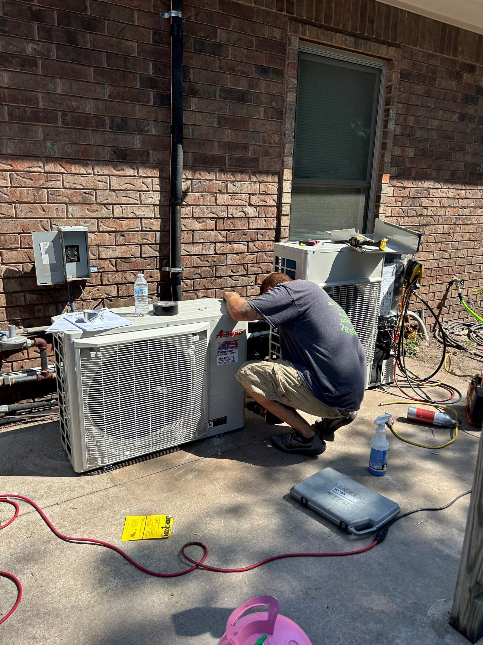 A HVAC technician doing installation